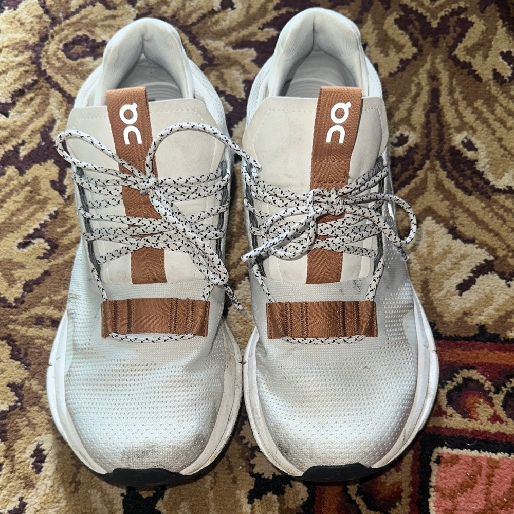 On Running White and Tan Athletic Shoes